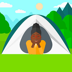 Image showing Woman lying in tent.