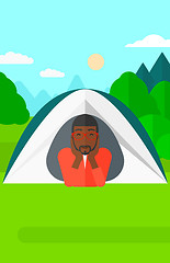 Image showing Man lying in tent.