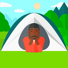 Image showing Man lying in tent.