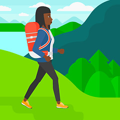 Image showing Woman with backpack hiking.