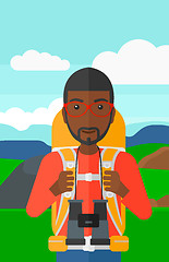 Image showing Cheerful backpacker with binoculars.