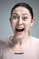 Image showing Portrait of young woman with shocked facial expression