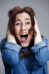 Image showing Portrait of young woman with shocked facial expression