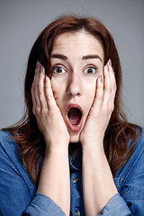 Image showing Portrait of young woman with shocked facial expression