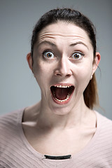 Image showing Portrait of young woman with shocked facial expression