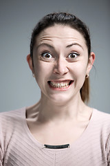 Image showing Portrait of young woman with shocked facial expression