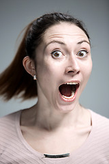 Image showing Portrait of young woman with shocked facial expression