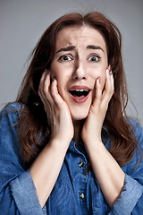 Image showing Portrait of young woman with shocked facial expression