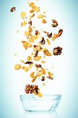 Image showing The cornflakes falling with walnuts