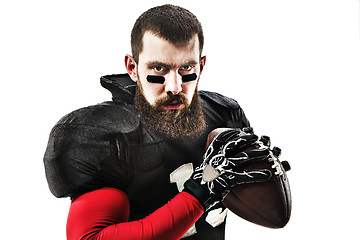 Image showing American football player posing with ball on white background