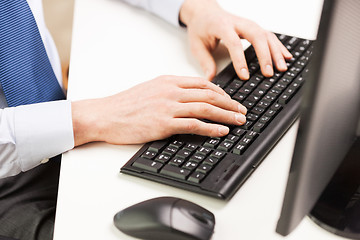 Image showing close up of businessman hands typing on keyboard