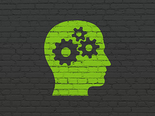 Image showing Advertising concept: Head With Gears on wall background