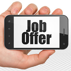 Image showing Finance concept: Hand Holding Smartphone with Job Offer on display