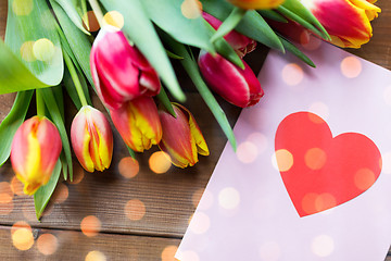 Image showing close up of flowers and greeting card with heart