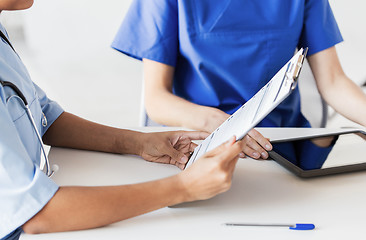 Image showing close up of doctor with medical report at hospital