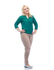 Image showing smiling young woman in shirt and trousers