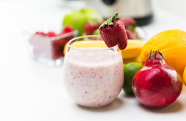 Image showing close up of glass with milk shake and fruits