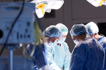 Image showing group of surgeons in operating room at hospital