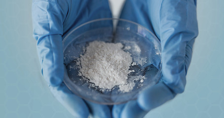 Image showing close up of scientist hands holding petri dish