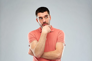 Image showing man thinking over gray background