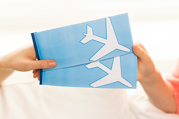 Image showing close up of hands with airplane tickets