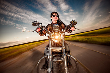 Image showing Biker girl on a motorcycle