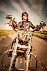 Image showing Biker girl on a motorcycle