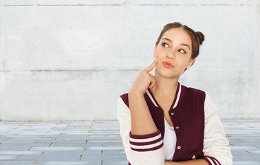 Image showing happy pretty teenage girl thinking