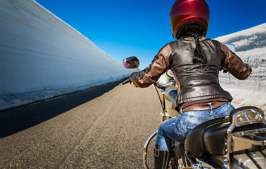 Image showing Biker girl First-person view, mountain serpentine.