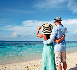 Image showing Vacation Couple walking on tropical beach Maldives.