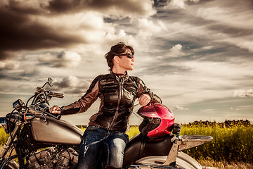 Image showing Biker girl on a motorcycle