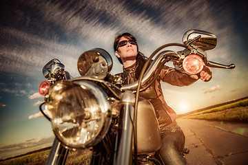 Image showing Biker girl on a motorcycle