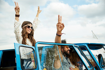 Image showing hippie friends over minivan car showing peace sign