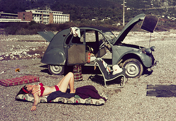 Image showing Original vintage colour slide from 1960s, young woman relaxing o