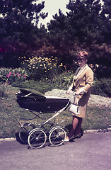 Image showing Original vintage  colour slide from 1960s, young woman walking h