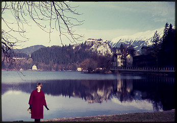 Image showing Original vintage colour slide from 1960s, woman standing by lake