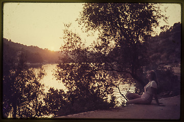 Image showing Original vintage colour slide from 1960s, young woman sitting by