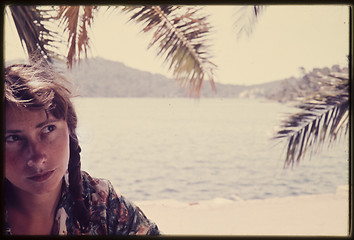 Image showing Original vintage colour slide from 1960s, young woman sitting by