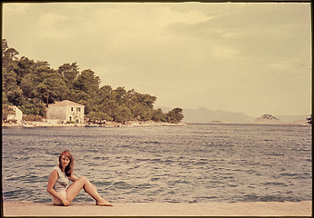 Image showing Original vintage colour slide from 1960s, young woman sitting by