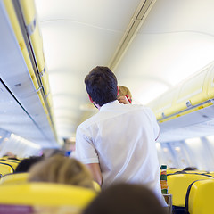 Image showing Steward on the airplane.