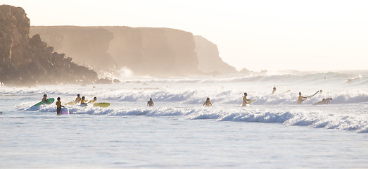 Image showing Surfers surfing on El Cotillo beach, Fuerteventura, Canary Islands, Spain.