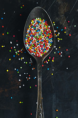 Image showing Colorful Sugar Balls in vintage spoon