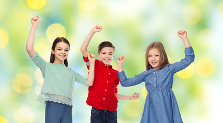 Image showing happy boy and girls celebrating victory