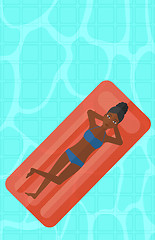 Image showing Woman relaxing in swimming pool.