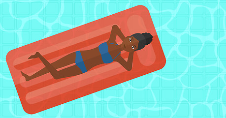 Image showing Woman relaxing in swimming pool.