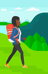 Image showing Woman with backpack hiking.