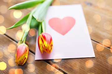 Image showing close up of flowers and greeting card with heart