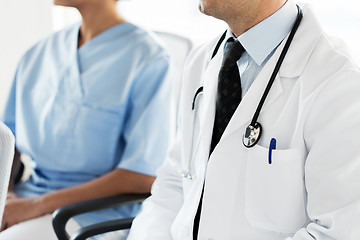 Image showing close up of happy doctors at seminar or hospital