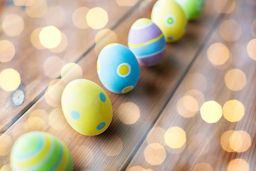 Image showing close up of colored easter eggs on wooden surface