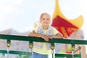 Image showing happy little girl climbing on children playground